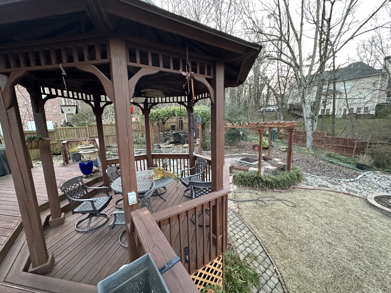 Residential deck and exterior before renovation — view 4