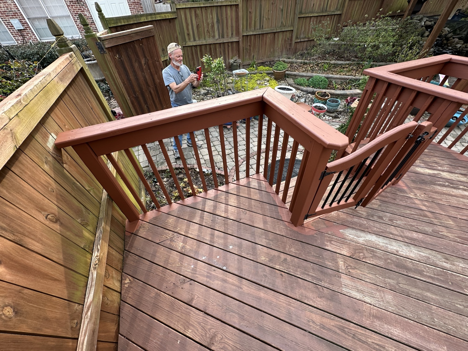 Residential deck and exterior before renovation — view 9